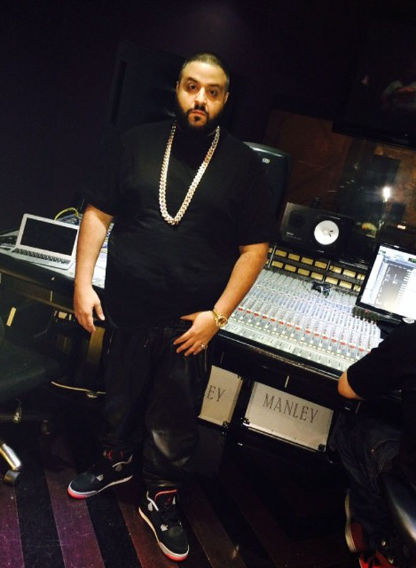 DJ Khaled wearing Air Jordan 4 Retro Black/Cement
