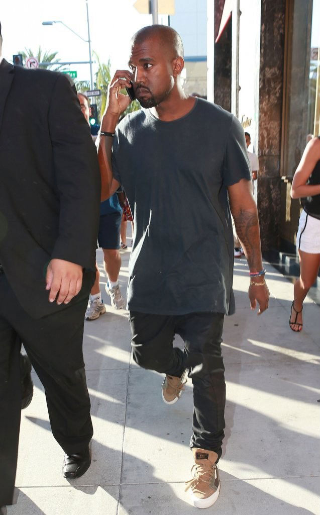 Kanye West wearing WTAPS x Vans Vault Sk8-Hi Olive (3)