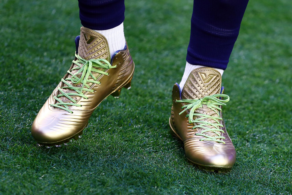 Marshawn Lynch wearing Gold Nike Vapor Speed Cleats for Super Bowl Warm-Ups (2)