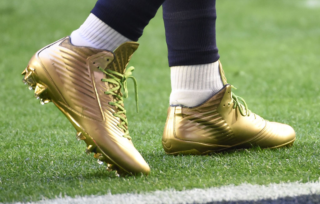Marshawn Lynch wearing Gold Nike Vapor Speed Cleats for Super Bowl Warm-Ups (1)