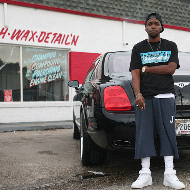 Curren$y wearing Nike Air Force 1 Mid