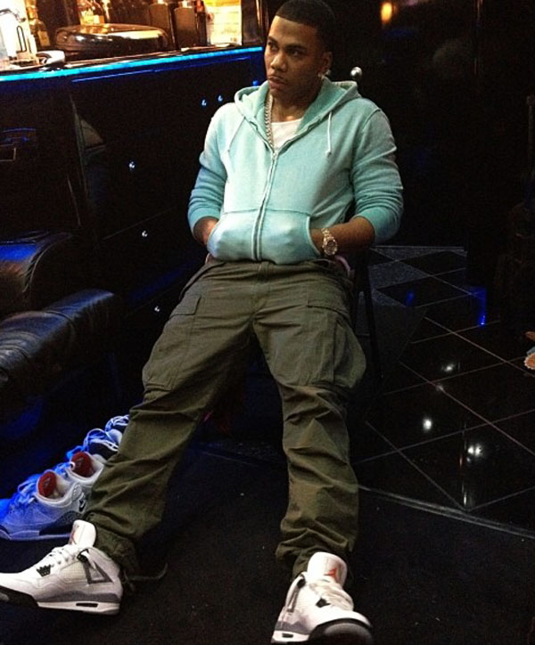 Nelly wearing Air Jordan 4 Retro Cement