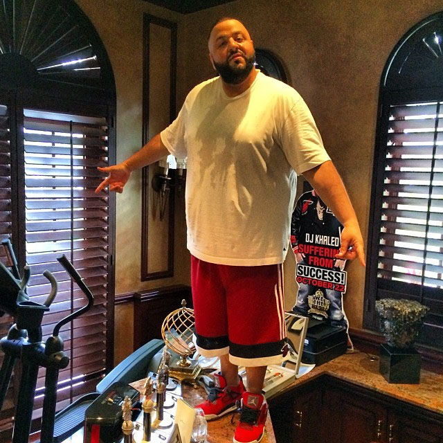 DJ Khaled wearing Air Jordan 4 Retro Toro