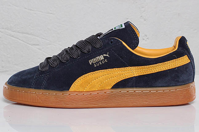 navy blue and gold pumas