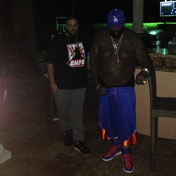 Rick Ross wearing Air Jordan I 1 Knicks; DJ Khaled wearing Air Jordan IV 4 Bred