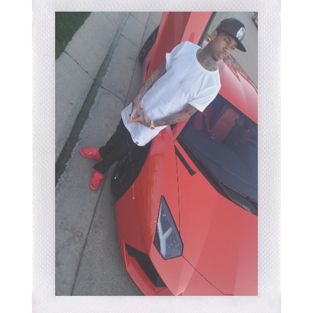 Tyga wearing Nike Air Yeezy 2 Red October