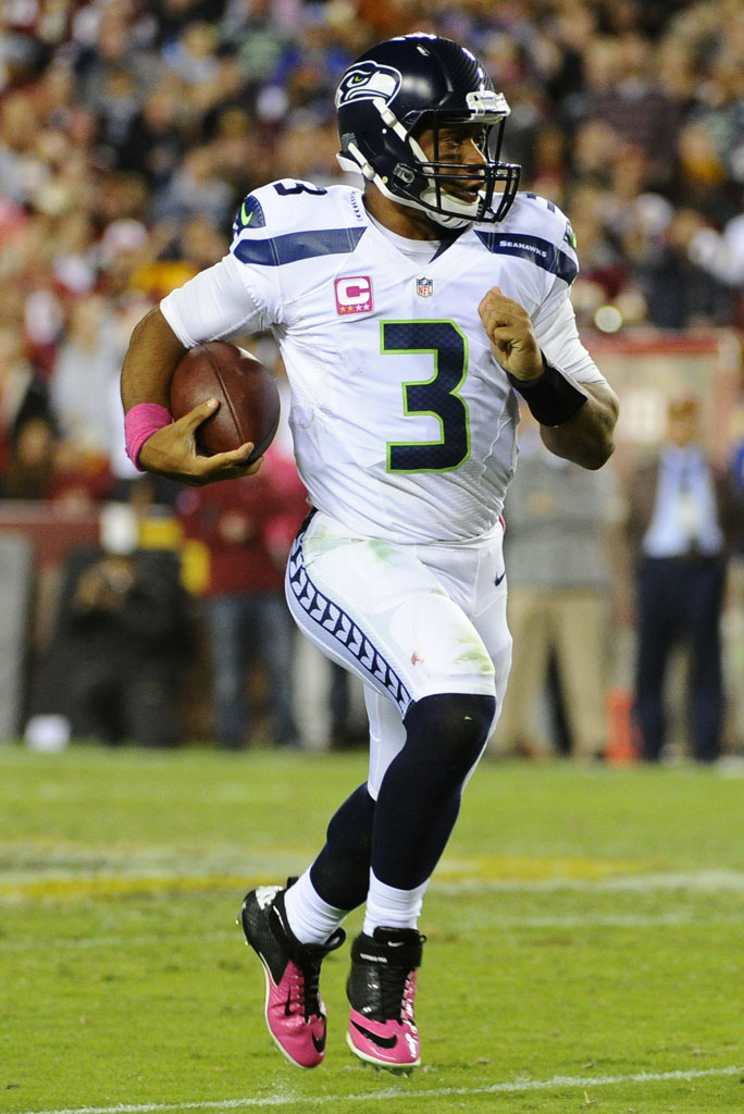 Russell Wilson wearing Nike Lunar Superbad Pro Breast Cancer Awareness Pink Cleats