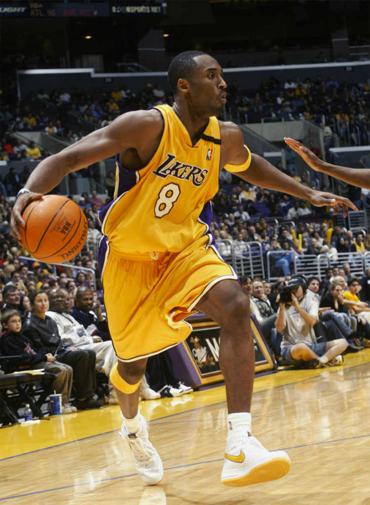 Kobe Bryant wearing Nike Air Force 1 Mid Lakers PE