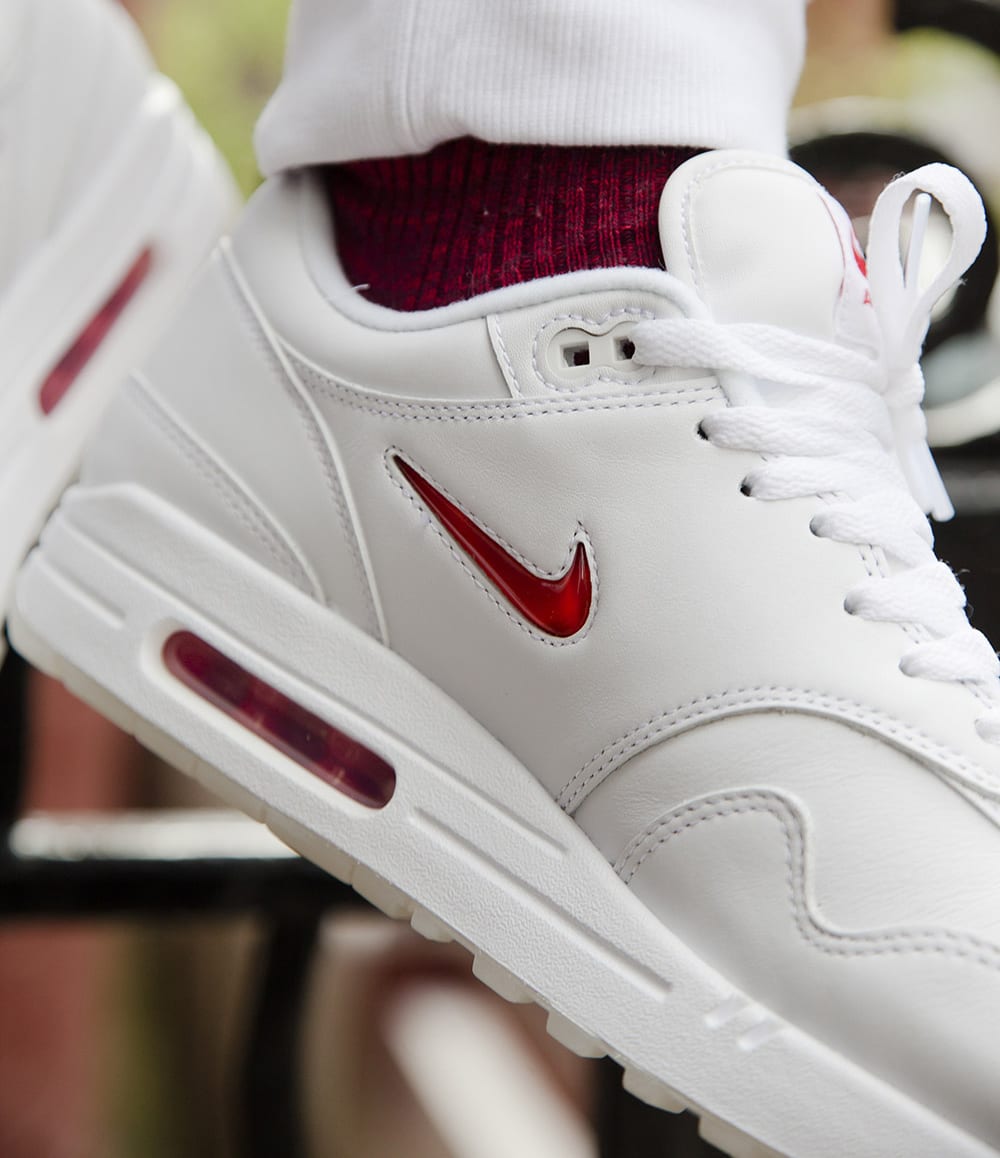 mens white nike shoes with red swoosh