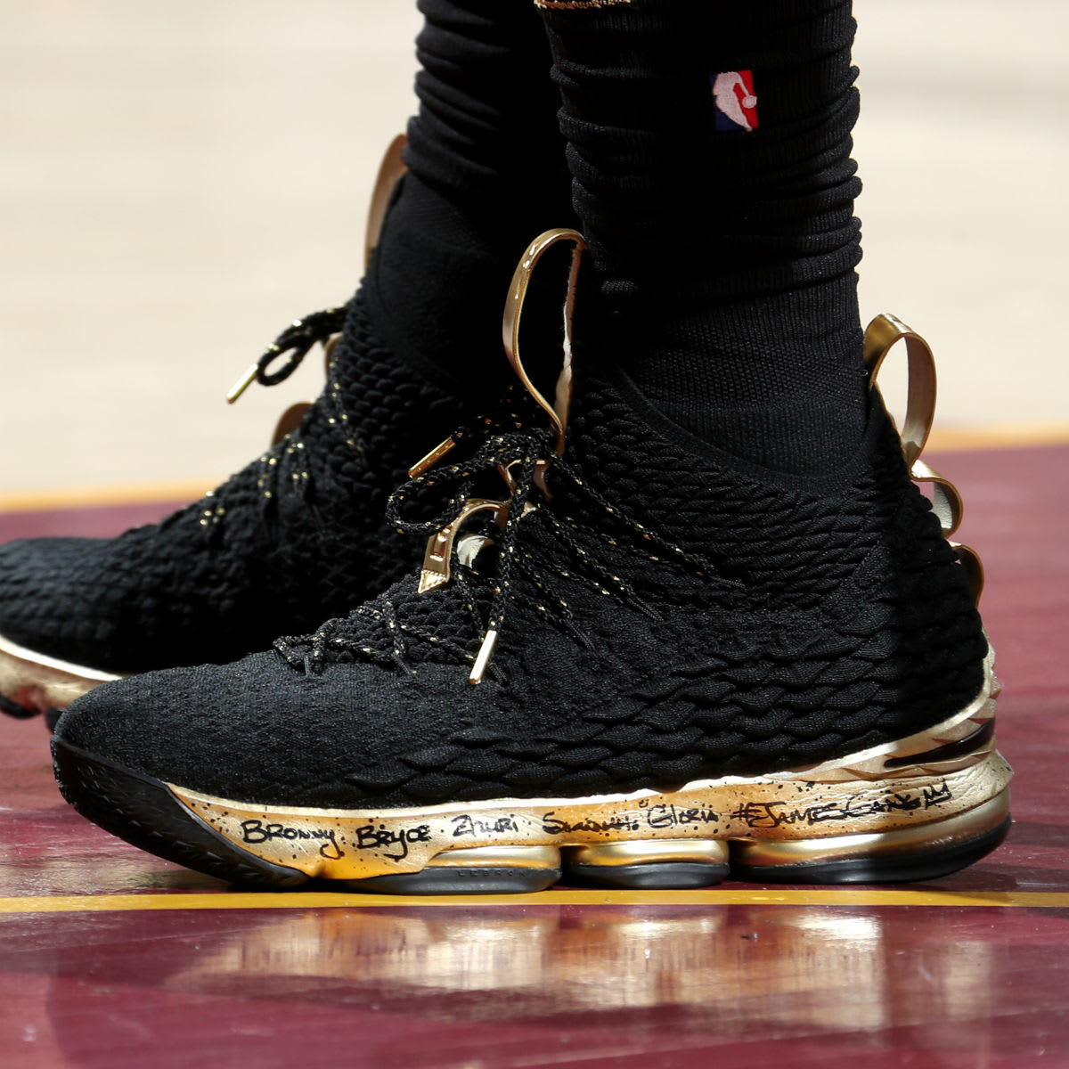 lebron james gold and black shoes