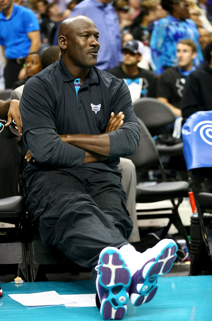 Michael Jordan wearing Air Jordan XIII 13 Hornets PE