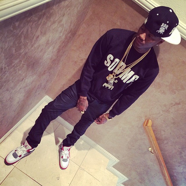 Soulja Boy wearing Air Jordan 4 Retro Fire Red