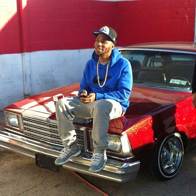 Currensy wearing Air Jordan XI 11 Cool Grey