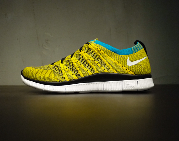 Nike Free Flyknit HTM SP in Tour Yellow Light Charcoal Neo Turquoise profile
