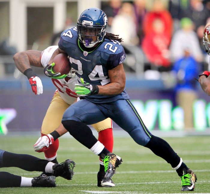 Marshawn Lynch wearing Nike Vapor Talon Elite Skittles (1)