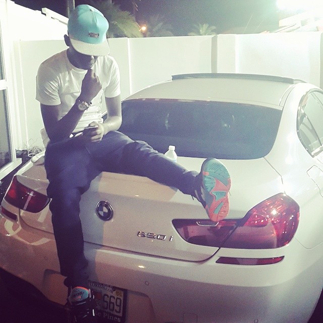 Bobby Schmurda wearing Ewing Wrap Black/Orange-Teal