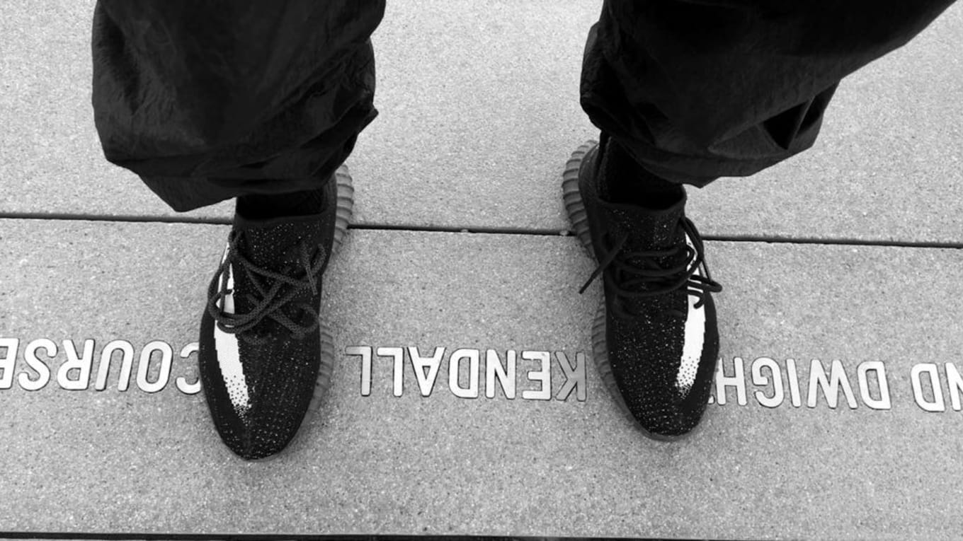 black yeezy with white stripe