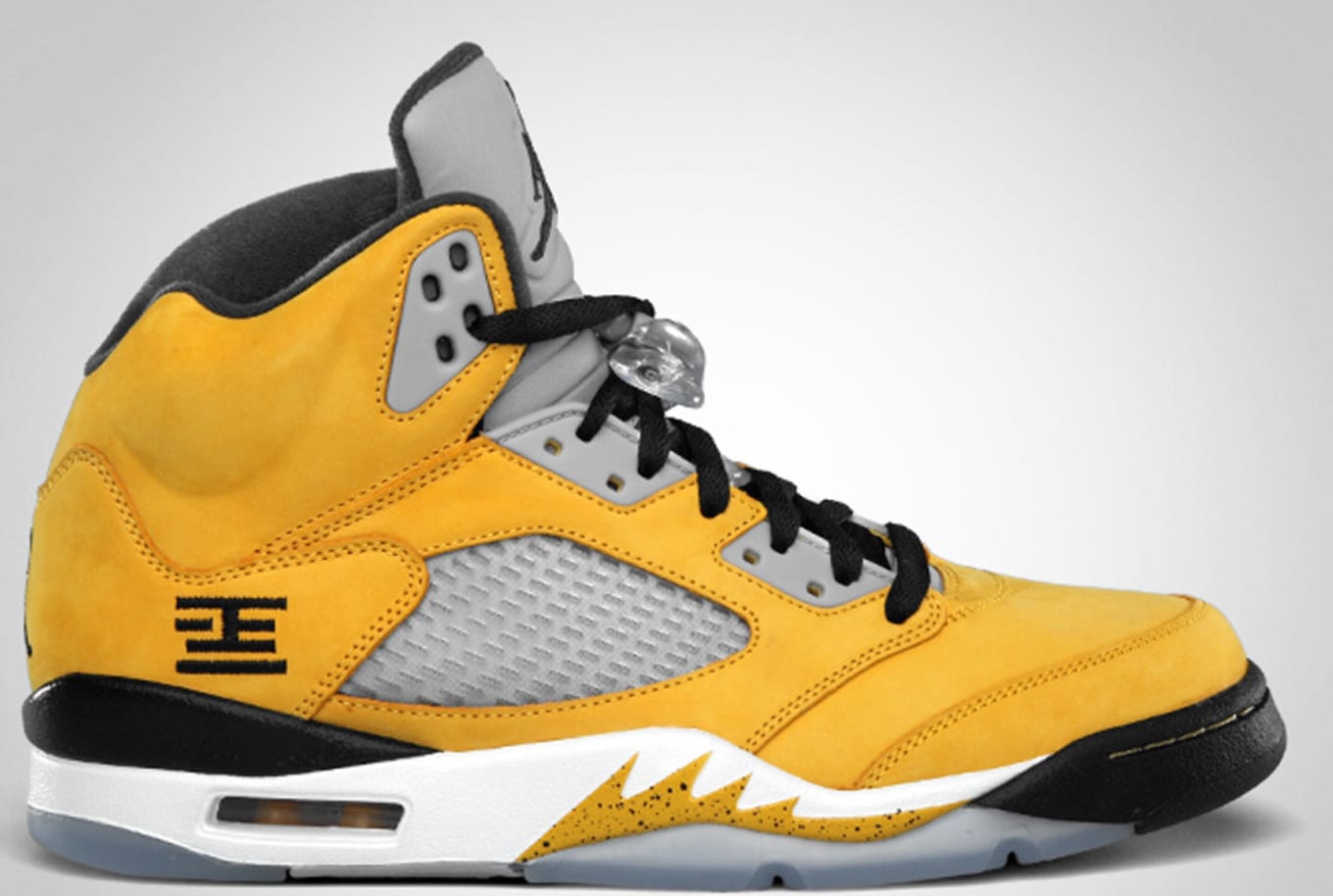 Yellow and black jordans 5