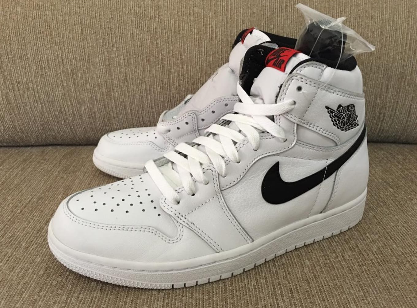 Jordan 1 white with black swoosh discount