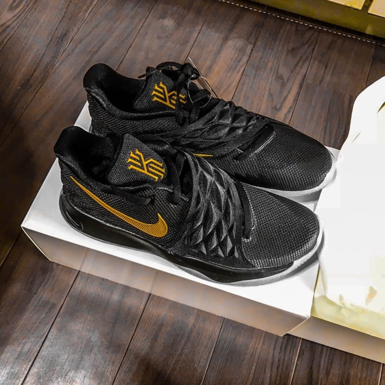 kyrie low id black and gold