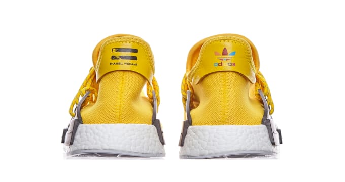 human race yellow sneakers