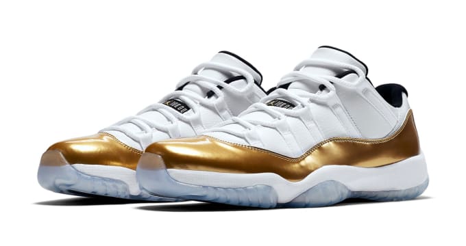 white and gold low top 11s