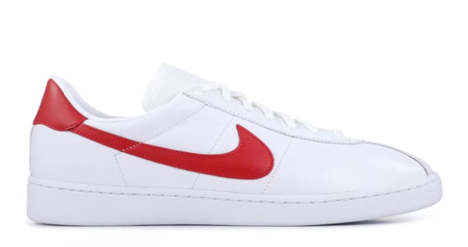 white nike bruin shoes with red swoosh