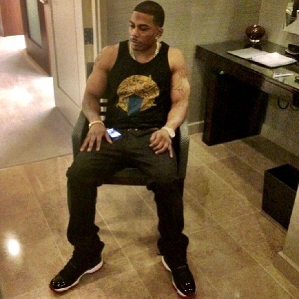 Nelly wearing Air Jordan 11 Black/Red