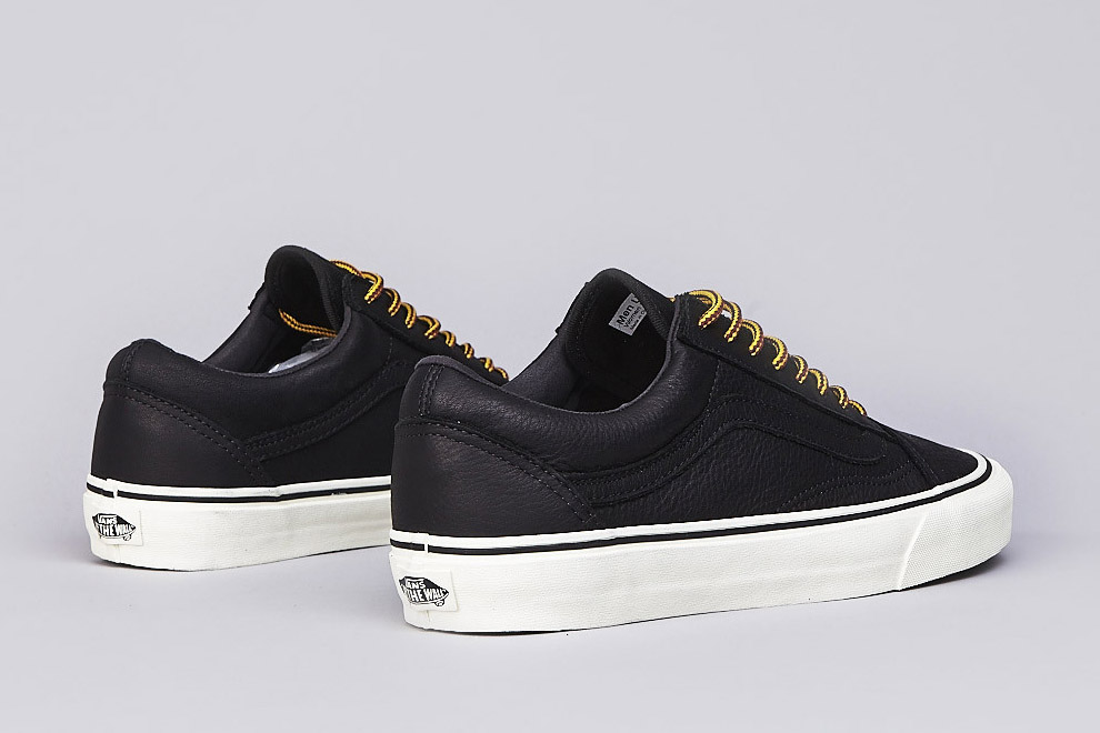 black leather vans with black sole 