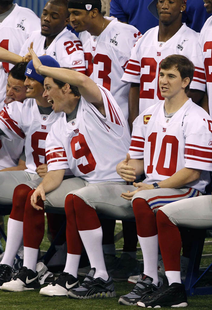 Eli Manning wearing Reebok Premier Zig Blaze; Lawrence Tynes wearing Nike Trainer 1.3