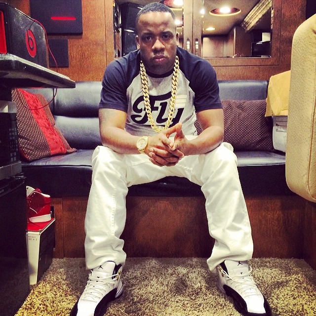 Yo Gotti wearing Air Jordan 12 Taxi