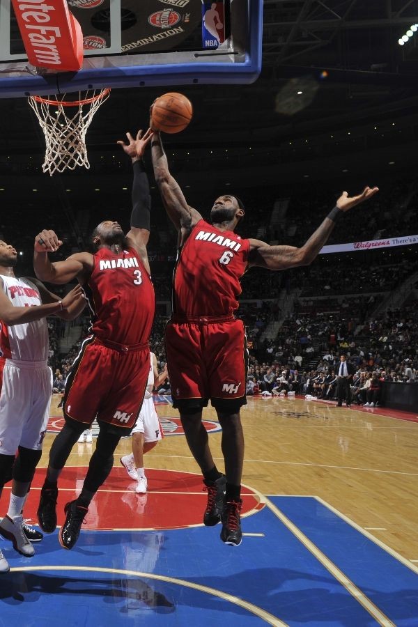 Dwyane Wade wears Black/Red/Orange Air Jordan 2011 PE against Pistons