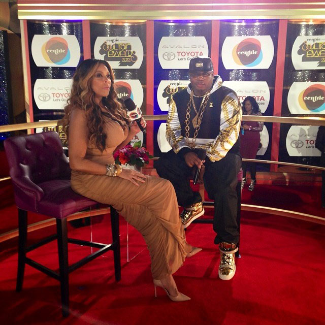 E-40 wearing Giuseppe Zanotti Gold Sneakers