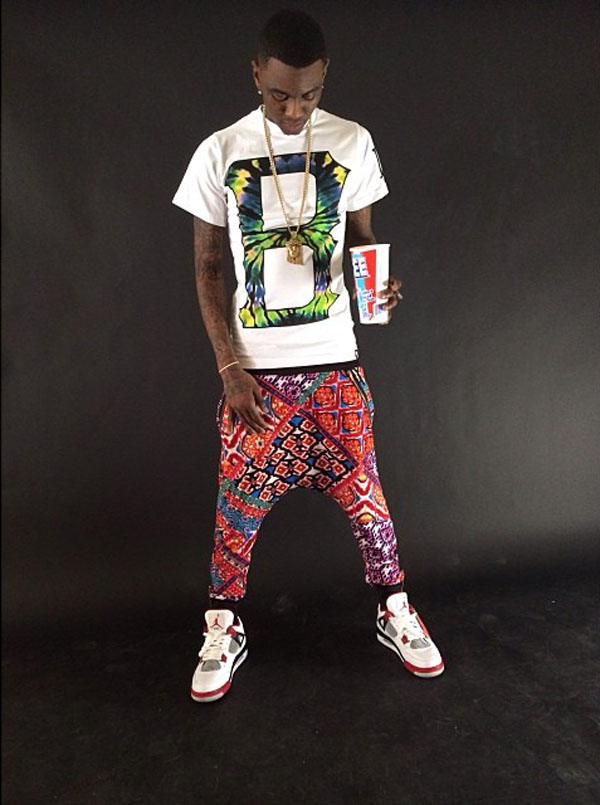 Soulja Boy wearing Air Jordan 4 Retro Fire Red