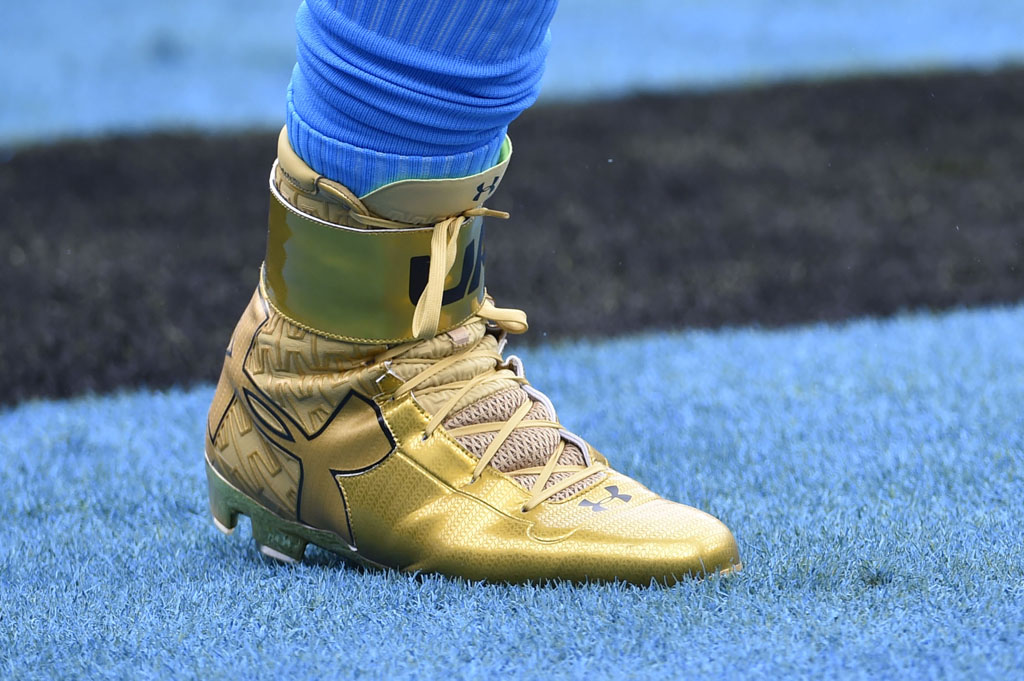 Cam Newton wearing Gold Under Armour Cleats (2)