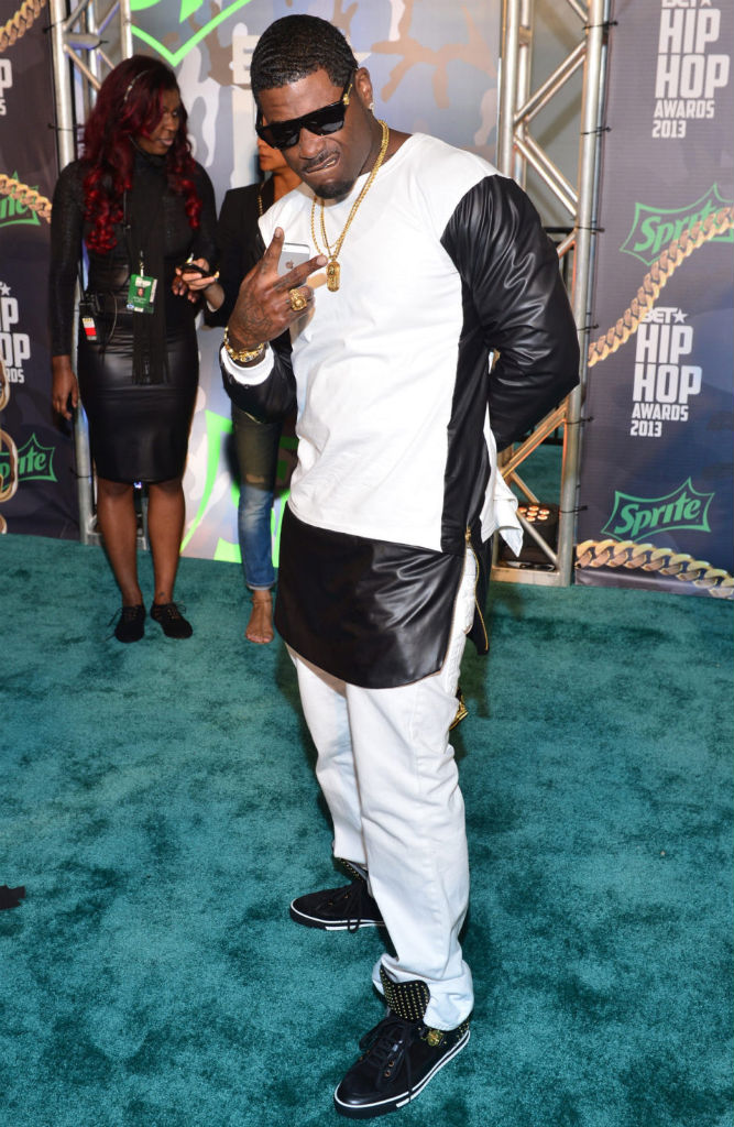 Memphitz wearing Versace Studded Sneakers