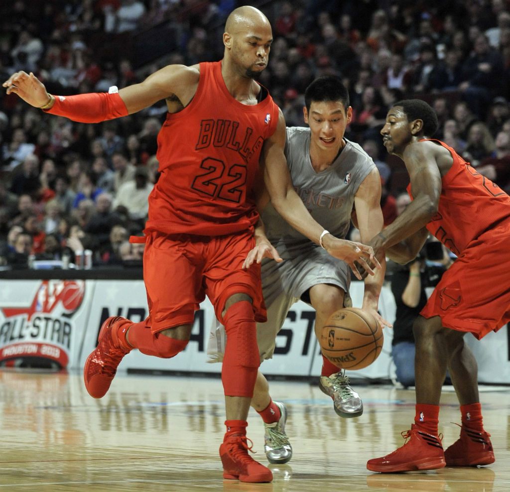 Taj Gibson wearing adidas Rose 773 Light; Marquis Teague wearing adidas Crazy Fast