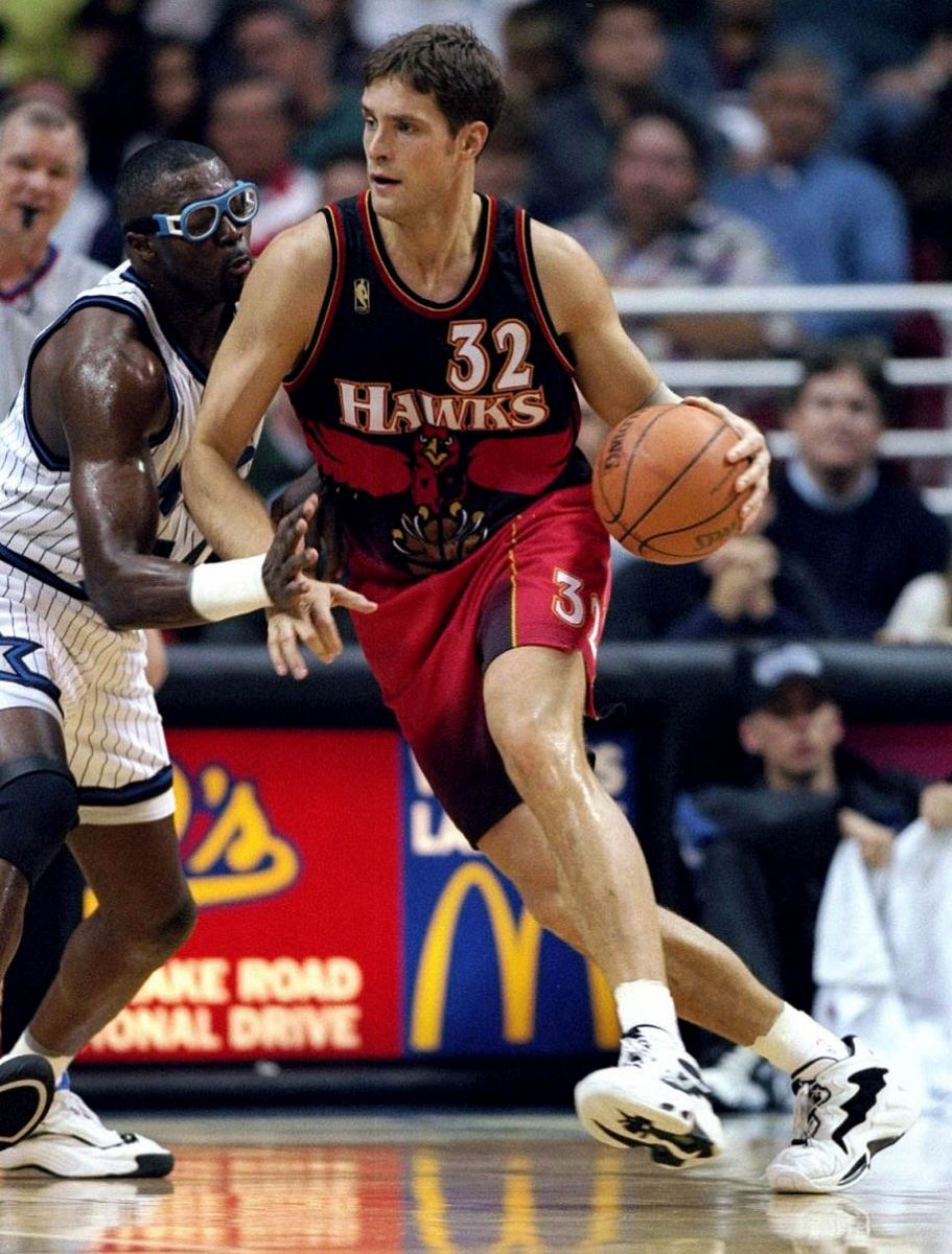 The Atlanta Hawk's Dikembe Mutombo, Steve Smith, and Mookie