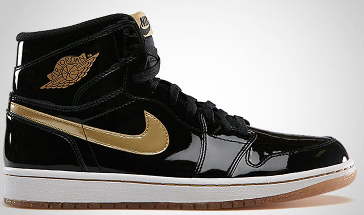 gold and black and white jordan 1