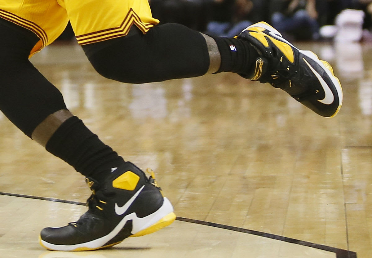 lebron james black and yellow shoes