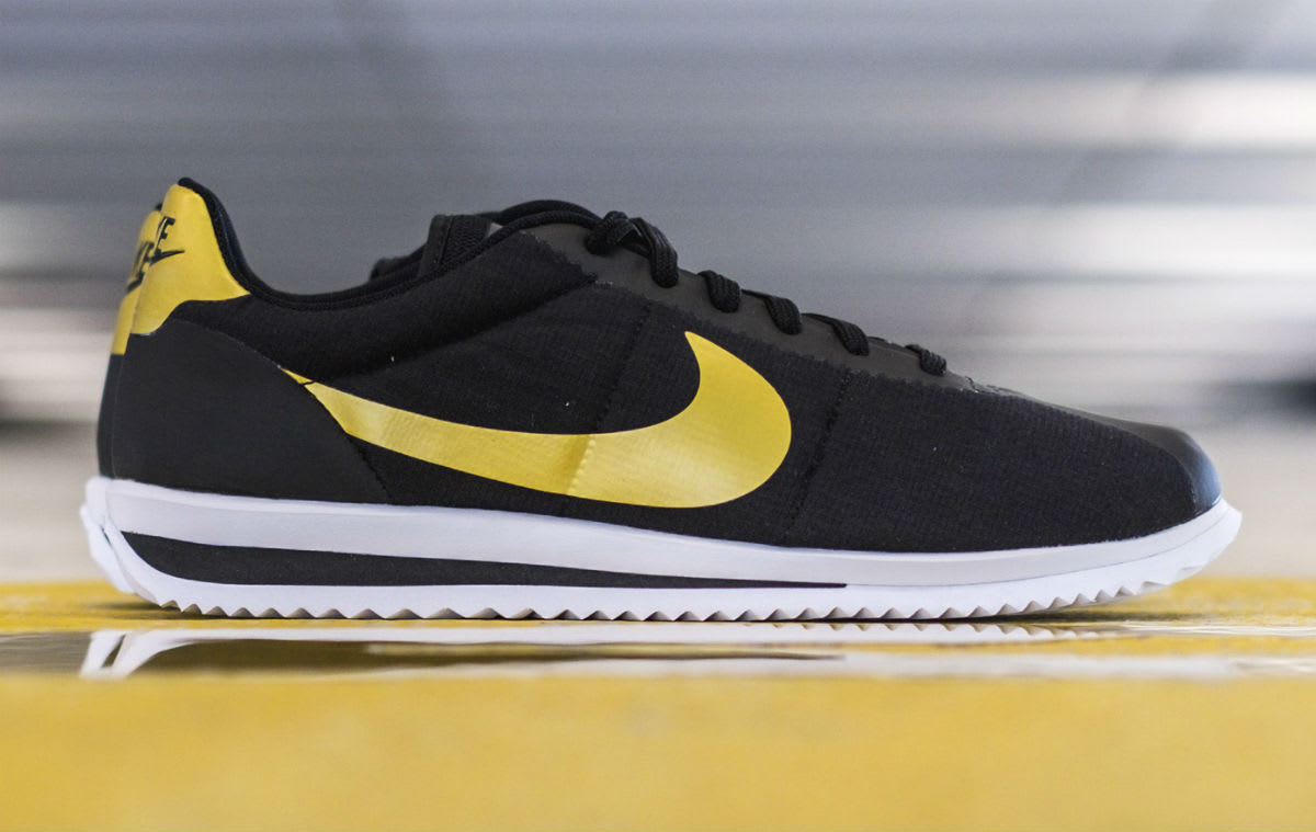 nike cortez black yellow