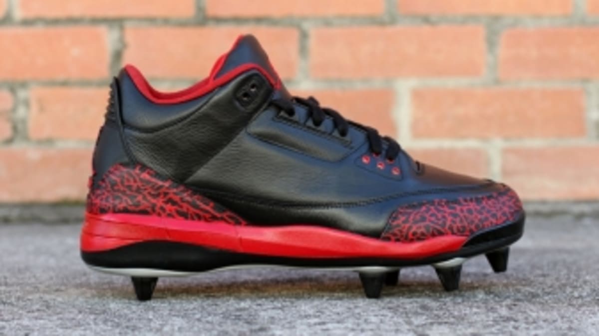 red and black jordan cleats