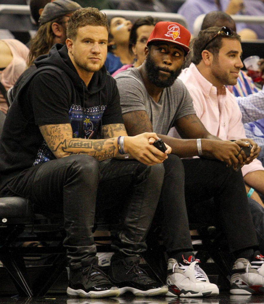 John Geiger wearing Air Jordan 11 XI Retro Space Jam; Darrelle Revis wearing Air Jordan 8 VIII Retro Bugs