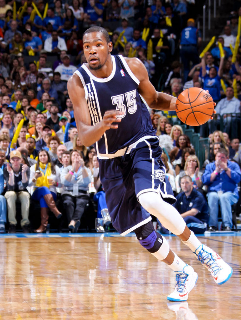 Kevin Durant wearing Oklahoma City Thunder Alternate Uniform and Nike KD V Home