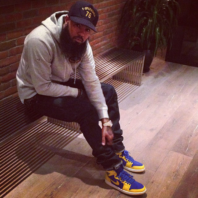 Stalley wearing Air Jordan 1 I Retro Laney