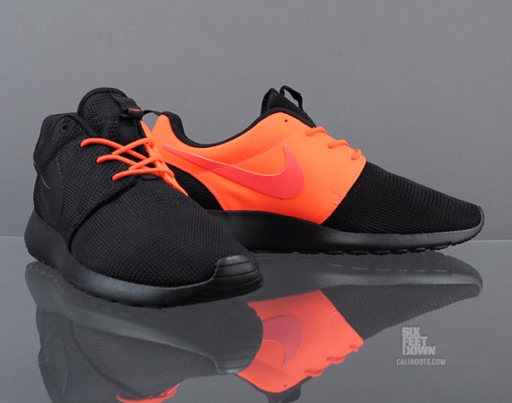 orange and black roshe runs