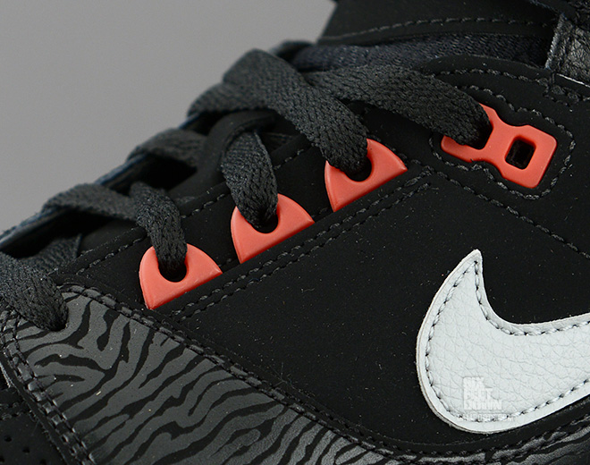 Nike Air Revolution in black silver red zebra detail