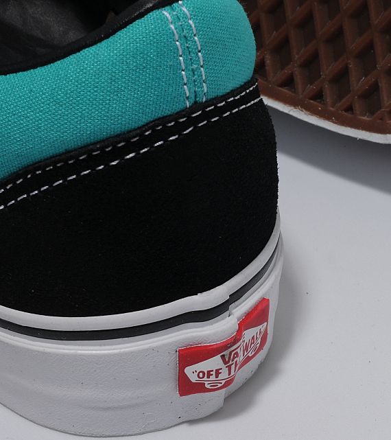 Black and shop turquoise vans