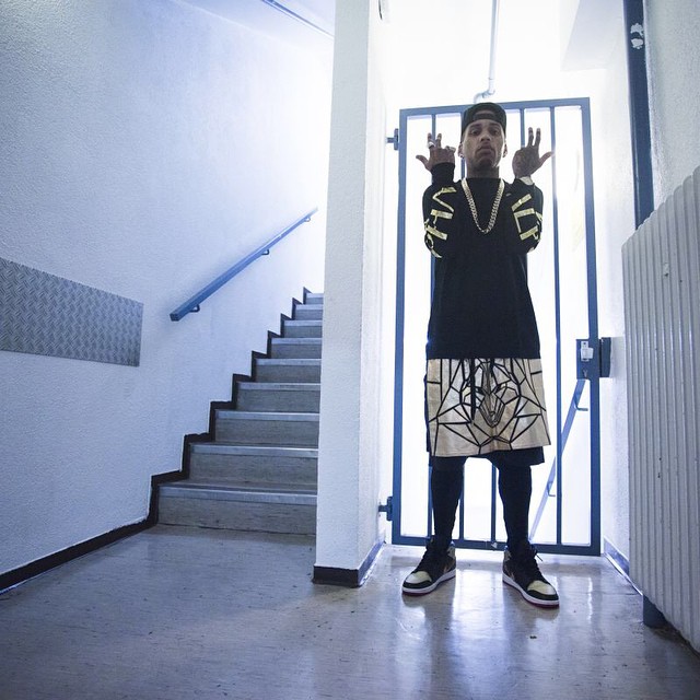 Kid Ink wearing Air Jordan 1 Retro Mid Black/Gold