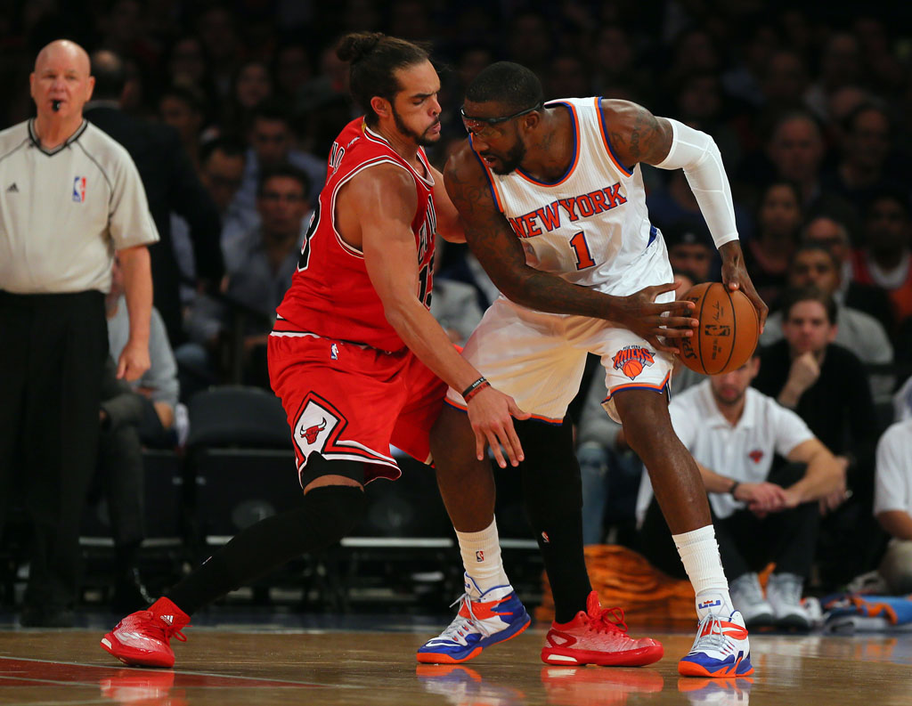 Joakim Noah wearing adidas Crazylight Boost; Amar'e Stoudemire wearing Nike Zoom Soldier 8 PE